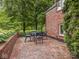 Brick patio with outdoor seating, perfect for enjoying the surrounding green space and private backyard at 1207 Pickwick Pl, Indianapolis, IN 46208
