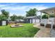 Spacious backyard featuring a fire pit, shed, and detached two car garage at 121 Ursal Ln, Greenwood, IN 46143