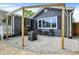 Cozy backyard patio with string lights, crushed gravel, and a stylish metal fire pit at 121 Ursal Ln, Greenwood, IN 46143