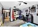 Spacious bedroom with carpet floors, ceiling fan, closet, and sports themed decor at 121 Ursal Ln, Greenwood, IN 46143