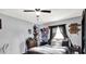 Cozy bedroom featuring a comfortable bed, a dresser, and a ceiling fan at 121 Ursal Ln, Greenwood, IN 46143