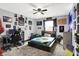 This bedroom features sporty decor, a ceiling fan, and a built-in desk for studying and hobbies at 121 Ursal Ln, Greenwood, IN 46143