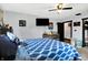Cozy bedroom features a ceiling fan, closet, and ample natural light through large windows at 121 Ursal Ln, Greenwood, IN 46143
