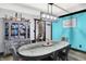 Dining room features include a wooden table, modern chandelier, gray-blue wall and an antique hutch at 121 Ursal Ln, Greenwood, IN 46143