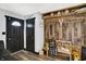 Welcoming entryway featuring wood-look flooring, rustic decor and a bench at 121 Ursal Ln, Greenwood, IN 46143