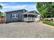 Charming one-story home with a grey exterior, inviting covered front porch and walkway at 121 Ursal Ln, Greenwood, IN 46143