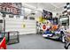 Spacious garage decorated with racing memorabilia, ready for projects and storage at 121 Ursal Ln, Greenwood, IN 46143