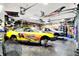 Spacious garage featuring race cars, tools, and ample storage space at 121 Ursal Ln, Greenwood, IN 46143