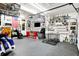 Well-organized garage with shelves of trophies, racing memorabilia, and work area at 121 Ursal Ln, Greenwood, IN 46143