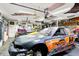 Well-organized garage with two race cars and plenty of room for projects at 121 Ursal Ln, Greenwood, IN 46143