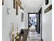 Hallway featuring decorative elements and an open doorway to a bedroom at 121 Ursal Ln, Greenwood, IN 46143