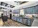 Kitchen with a center island, stainless steel appliances, granite countertops and striking blue wooden cabinets at 121 Ursal Ln, Greenwood, IN 46143