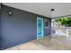 Covered patio with a blue accent door, offering a relaxing outdoor space at 121 Ursal Ln, Greenwood, IN 46143