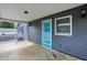 Spacious covered patio with a blue accent door and a view of the backyard at 121 Ursal Ln, Greenwood, IN 46143