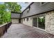 Stone and wood exterior with deck, sliding glass door, and wooden rails provides great entertaining space at 12118 Castle Row Overlook, Carmel, IN 46033