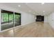 Finished basement with sliding doors leading to a deck and walk-out access at 12118 Castle Row Overlook, Carmel, IN 46033