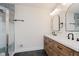 Modern bathroom with a double sink vanity and sleek tile shower at 12118 Castle Row Overlook, Carmel, IN 46033