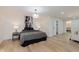 Inviting main bedroom with a large bed, neutral tones, and a view to the bathroom at 12118 Castle Row Overlook, Carmel, IN 46033