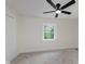 Cozy bedroom with plush carpeting, a ceiling fan, and a bright window at 12118 Castle Row Overlook, Carmel, IN 46033