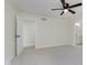 Bright bedroom featuring plush carpet and an ensuite bathroom entrance at 12118 Castle Row Overlook, Carmel, IN 46033