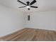 Spare bedroom featuring wood-look floors and a modern ceiling fan at 12118 Castle Row Overlook, Carmel, IN 46033