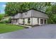 Spacious home with attached garage, stone accents, covered entryway, and a large driveway at 12118 Castle Row Overlook, Carmel, IN 46033