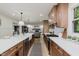 Bright, open kitchen features stainless steel appliances and hardwood floors at 12118 Castle Row Overlook, Carmel, IN 46033