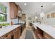 Modern kitchen with stainless steel appliances, white subway tiles, and hardwood floors at 12118 Castle Row Overlook, Carmel, IN 46033