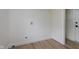 Clean laundry room features a bright white color scheme and plenty of open space at 12118 Castle Row Overlook, Carmel, IN 46033