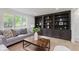 Inviting living room with natural light, built-in shelving, and a comfortable sofa at 12118 Castle Row Overlook, Carmel, IN 46033