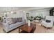 Spacious living room with hardwood floors and a view into the connected kitchen at 12118 Castle Row Overlook, Carmel, IN 46033