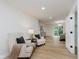 Spacious main bedroom with lounge chairs, access to a balcony, and a view into the bedroom at 12118 Castle Row Overlook, Carmel, IN 46033