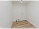 Simple utility room with wood-look flooring and basic hookups at 12118 Castle Row Overlook, Carmel, IN 46033