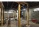 Unfinished basement with concrete walls, wooden support beams, and visible utilities, ready for customization at 1217 Newman St, Indianapolis, IN 46201