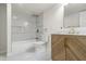 Bright bathroom featuring a tub shower, modern vanity with gold fixtures, and pristine finishes at 1217 Newman St, Indianapolis, IN 46201