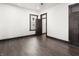 Spacious bedroom with hardwood floors, great natural light, and an access door at 1217 Newman St, Indianapolis, IN 46201