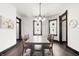 Elegant dining room with a modern chandelier and dark wood floors at 1217 Newman St, Indianapolis, IN 46201