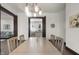 Charming dining room with modern lighting, hardwood floors, and easy access to the kitchen and living room at 1217 Newman St, Indianapolis, IN 46201