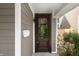 Close-up of a charming wood front door with glass detail and a white mailbox at 1217 Newman St, Indianapolis, IN 46201