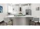 Bright, modern kitchen featuring white cabinets, stainless steel appliances, and a quartz countertop island at 1217 Newman St, Indianapolis, IN 46201