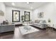 Cozy living room with gray furniture, white walls, dark trim, and stylish decor at 1217 Newman St, Indianapolis, IN 46201