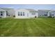 Spacious backyard with a concrete patio and ample green space for relaxation and recreation at 13448 Mosaic St, Fishers, IN 46037