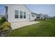 Well-maintained backyard featuring a concrete patio and lush green grass, perfect for outdoor enjoyment at 13448 Mosaic St, Fishers, IN 46037
