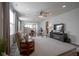 Bright living room featuring a ceiling fan, hardwood floors and an open-concept design for modern living at 13448 Mosaic St, Fishers, IN 46037