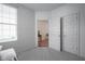 Bright office with neutral carpet, a window with blinds, and two doors at 13448 Mosaic St, Fishers, IN 46037