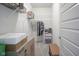 Walk-in closet with wire shelving, carpet flooring, and a wooden shoe-storage bench at 13448 Mosaic St, Fishers, IN 46037