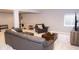 Spacious basement featuring gray sofa, chair and carpet and weight equipment at 13820 Woodside Hollow Dr, Carmel, IN 46032