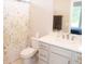 Clean bathroom featuring a modern vanity, floral shower curtain, and neutral color scheme at 13820 Woodside Hollow Dr, Carmel, IN 46032