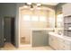 Stylish bathroom showcasing a walk-in shower, vanity with ample counter space, and contemporary lighting at 13820 Woodside Hollow Dr, Carmel, IN 46032