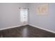 Bedroom featuring light blue walls, wood flooring and window with sheer curtains at 13820 Woodside Hollow Dr, Carmel, IN 46032